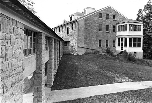 Side view of a stone dormitory building