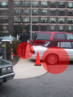 Car blocking sidewalk.